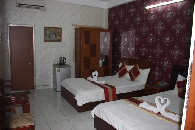 غرفة ديلوكس ثلاثية بسرير كوين وسرير فردي بإطلالة على المدينة، Yoko Airport Saigon Hotel 5/10