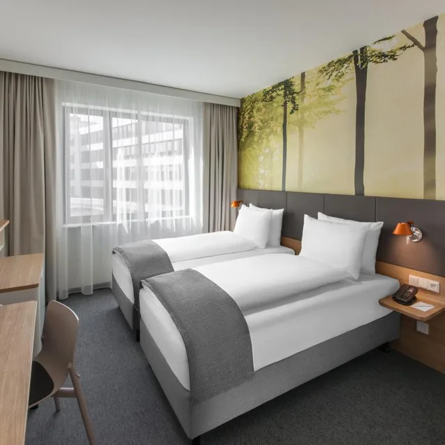 غرفة قياسية بسرير فردي بإطلالة على الفناء، Holiday Inn Munich Leuchtenbergring, an IHG Hotel 3/9