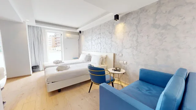 غرفة قياسية بسريرين منفصلين مع أريكة، The G Hotel by JL 1/2