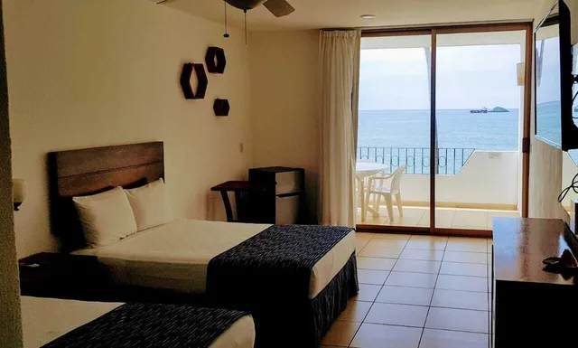 غرفة بسريرين مزدوجين بإطلالة على البحر، Costa Alegre Hotel And Suites 6/7