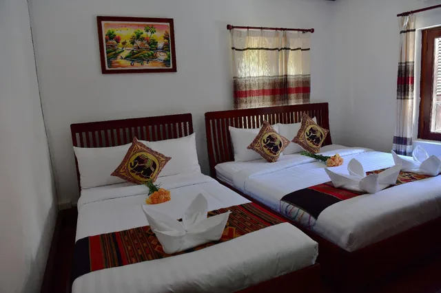 غرفة ديلوكس ثلاثية بسرير فردي، Thatsaphone Hotel 1/2
