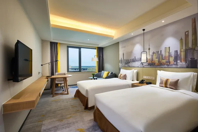 غرفة ديلوكس بسريرين منفصلين بإطلالة على البحر، The Qube Hotel Shanghai Sanjiagang 1/2