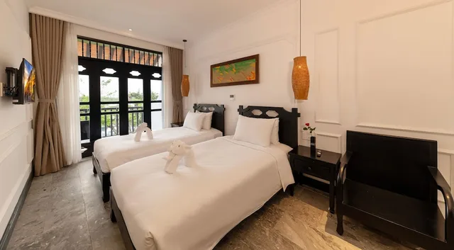 غرفة عائلية بسريرين منفصلين وسرير كينج بإطلالة على المدينة، Hoi An Coco River Resort Spa 5/10