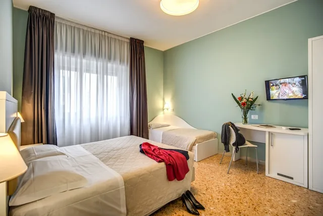 غرفة ديلوكس ثلاثية بسرير مزدوج وسرير فردي، Casa Ravasco 1/5