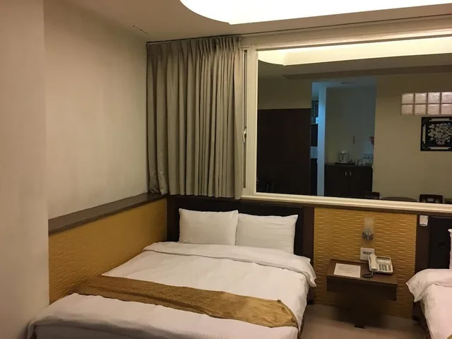 غرفة ديلوكس رباعية بسريرين مزدوجين، Ri Yue Hu Pan Hotel 1/4