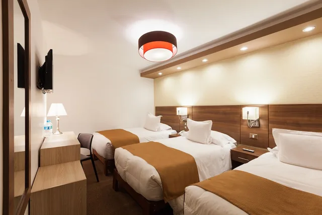 غرفة عائلية رباعية بسرير كوين وسريرين منفصلين بغرفة نوم واحدة، Inti Punku Machu Picchu Hotel And Suites 1/3