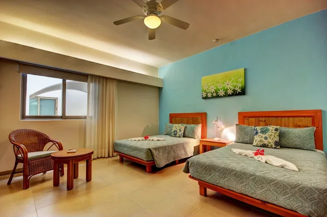 2 Bedrooms, Riviera, 1 King and 2 Double Beds, Garden View، Riviera Maya Suites 7/10