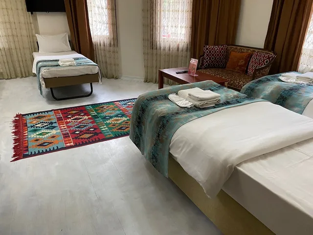 غرفة عائلية بسرير كوين وسريرين فرديين، Atam Suites Apart 3/10