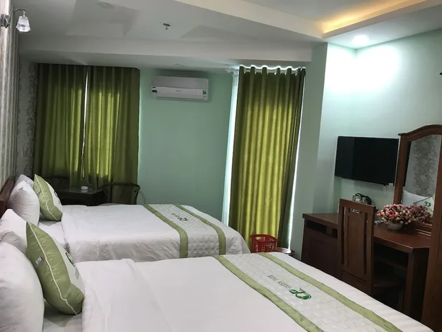 غرفة ديلوكس رباعية بسريرين مزدوجين بإطلالة على المتنزه، Green Park Hotel Quy Nhon 1/7