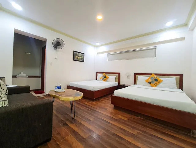 غرفة عائلية رباعية بسريرين مزدوجين بإطلالة على الحديقة للمدخنين، QUAN QUAN HOTEL 2/6