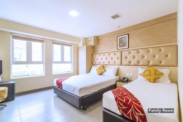 غرفة ديلوكس عائلية بسرير كوين وسرير فردي، Sandpiper Hotel 6/9