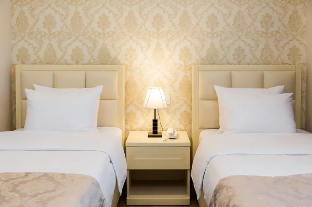 غرفة ديلوكس بسريرين منفصلين، Orchid Boutique Hotel 1/3