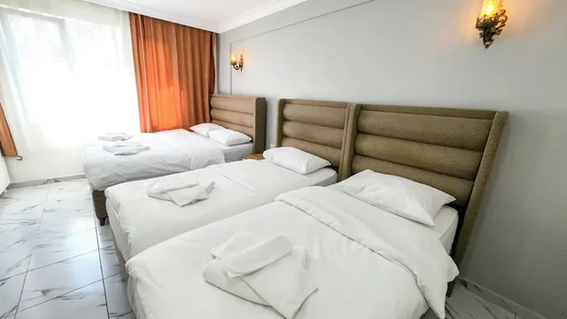 غرفة اقتصادية رباعية بسرير مزدوج وسريرين منفصلين بغرفة نوم واحدة، Laos Otel 7/10