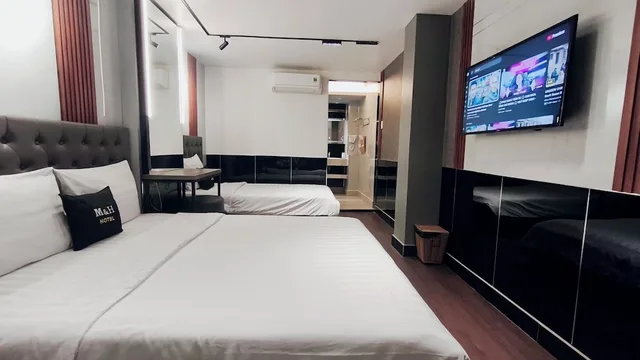 غرفة تنفيذية ثلاثية بسرير كوين وسرير فردي، Moc Huong Hotel 1/10
