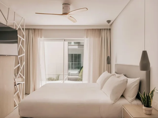 جناح جونيور بسريرين منفصلين بإطلالة جزئية على البحر، MiM Mallorca member of Melia Collection 1/4