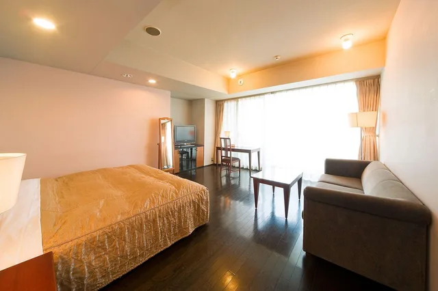 غرفة بسريرين منفصلين تُحدَّد عند الوصول مع أريكة للمدخنين، The Residential Suites Fukuoka Ex Hyatt Residential Suites Fukuoka 1/2