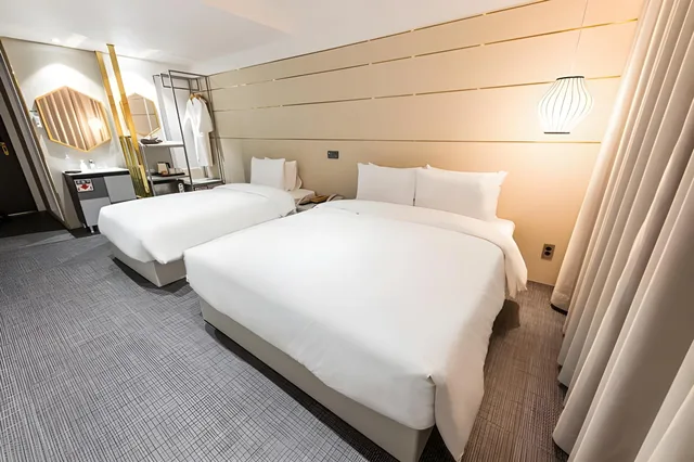 غرفة ديلوكس عائلية بسريرين منفصلين، Hotel the Grang Seogwipo 1/1