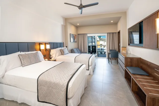 جناح جونيور بسريرين مزدوجين بإطلالة جزئية على البحر، RIU Palace Kukulkan - Adults Only - All Inclusive 1/3