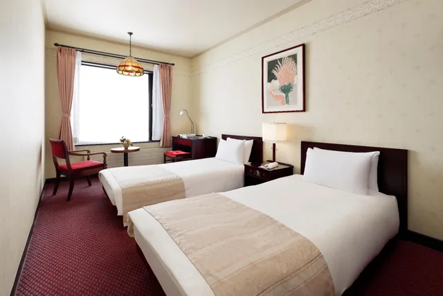 غرفة بسريرين منفصلين في المبنى الرئيسي للمدخنين، Manza Prince Hotel 1/1