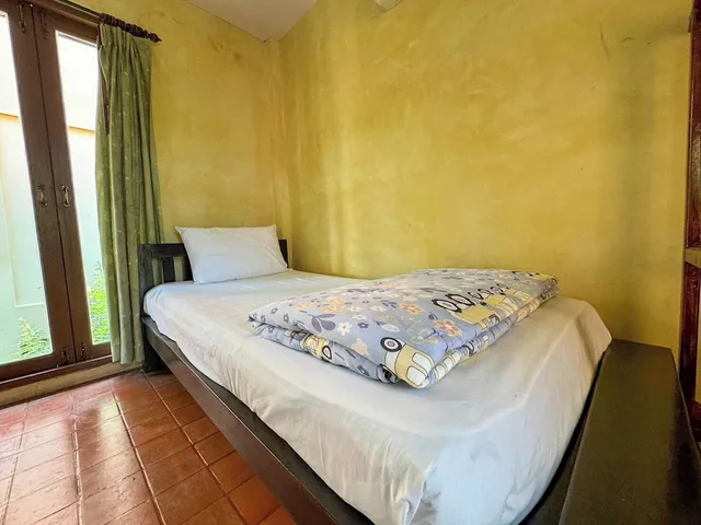 غرفة ديلوكس ثلاثية بسرير مزدوج وسرير فردي، Baanbali Beach Resort 1/8