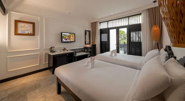 غرفة ديلوكس بسريرين منفصلين بإطلالة على المسبح، Hoi An Coco River Resort Spa 2/2