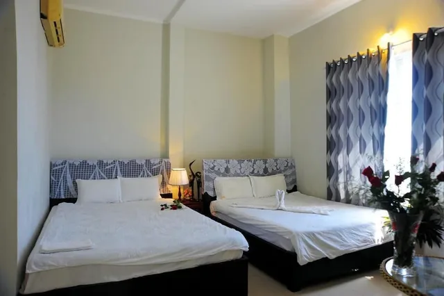 غرفة رباعية بسريرين مزدوجين، Minh Hung Hotel 1/8