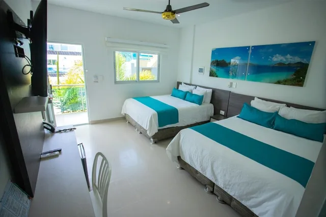 غرفة قياسية رباعية بسريرين مزدوجين، Hotel Poblado Covenas 2/5