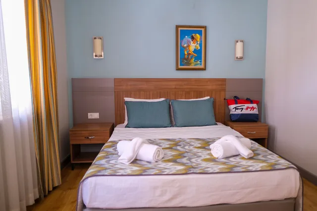 غرفة عائلية بسرير كوين وسريرين منفصلين، Side Village Hotel 6/9