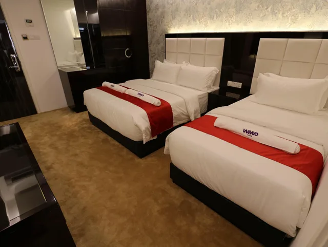 غرفة ديلوكس ثلاثية بسرير كوين وسرير فردي، Wiwo Hotel 2/3