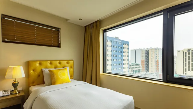 غرفة ديلوكس بسرير مزدوج وسرير فردي، Haema Hotel 3/8