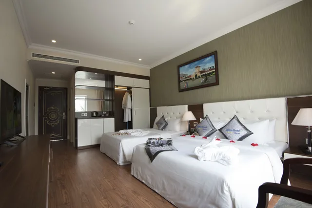 غرفة ديلوكس بسريرين منفصلين وسرير كوين بإطلالة على البحر، Thien Thanh Resort 4/6