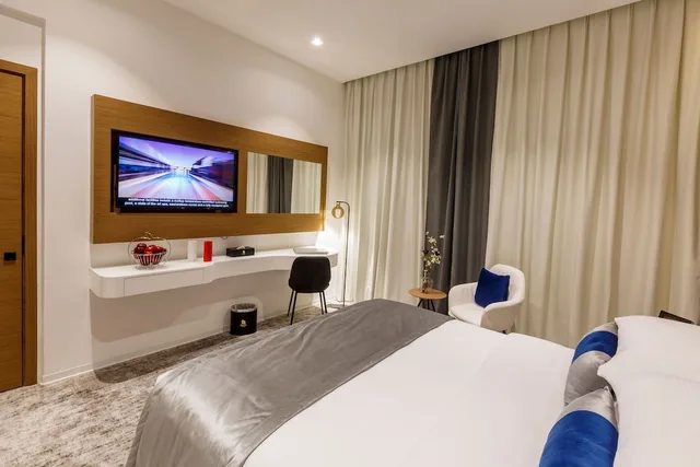 غرفة متصلة تنفيذية بسرير كوين وسريرين منفصلين، Rose Executive Hotel DWTC 2/7