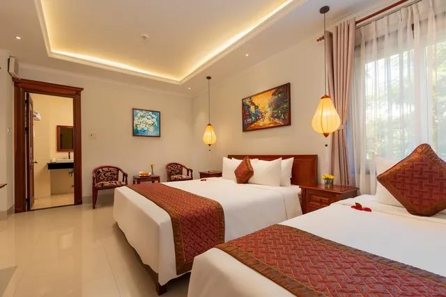غرفة ديلوكس ثلاثية بسرير كوين وسرير فردي، Iris Villa Hoi an 1/4