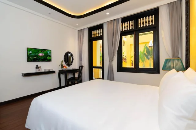 غرفة بسرير مزدوج بإطلالة على الحديقة، Lantern Boutique Hoi An 6/10
