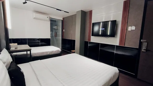 غرفة تنفيذية ثلاثية بسرير كوين وسرير فردي، Moc Huong Hotel 7/10