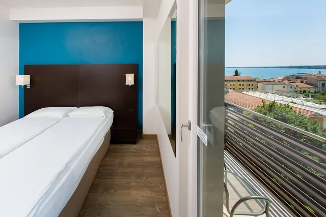 غرفة بسريرين منفصلين بإطلالة على البحيرة، Hotel Bonotto 3/6