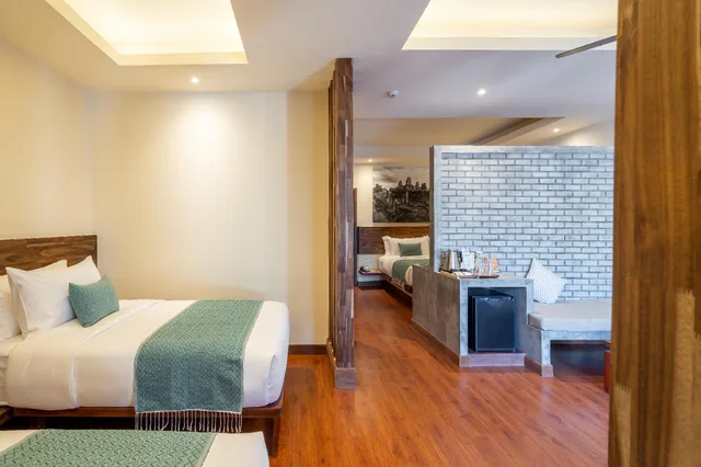 غرفة عائلية بسرير كينج وسريرين منفصلين بإطلالة على الحديقة، Amatak Boutique Hotel 2/2