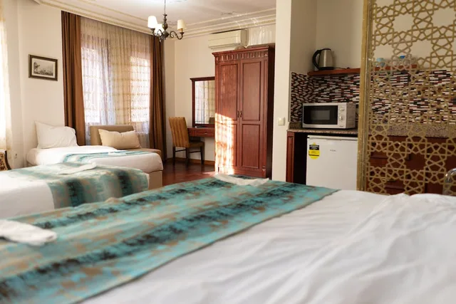 غرفة عائلية بسرير كوين وسريرين فرديين، Atam Suites Apart 7/10