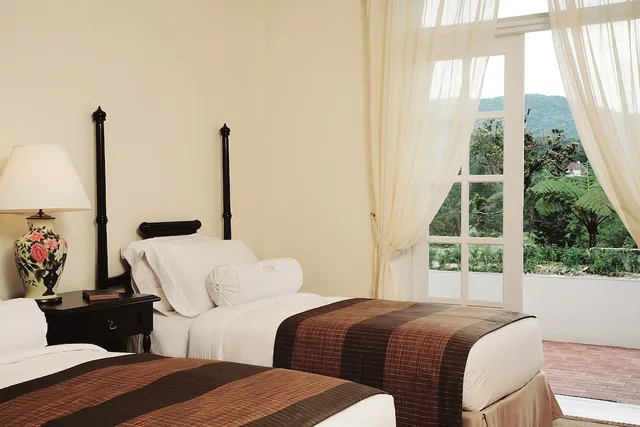 غرفة ديلوكس بسرير كينج بشرفة، CAMERON HIGHLANDS RESORT 2/4