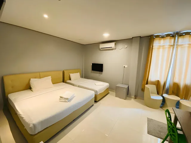 غرفة ثلاثية، Dlima Beach Inn 1/2