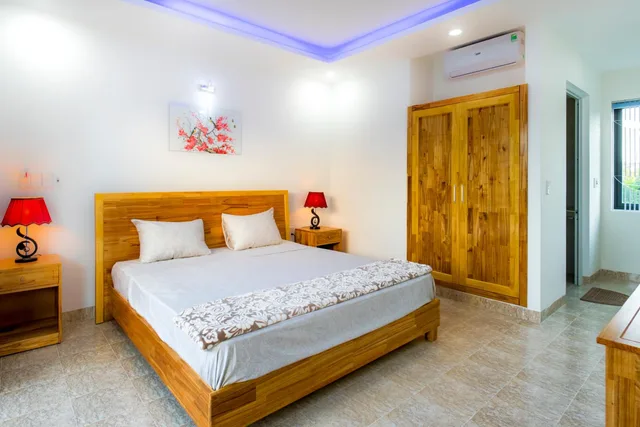غرفة ديلوكس بسرير كوين بشرفة، Tran Family Villas Boutique Hotel 4/7