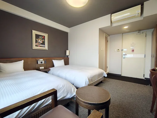 غرفة بسريرين منفصلين في المبنى الرئيسي للمدخنين، Hotel Route-Inn Iwakiizumi Ekimae 6/10