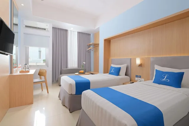 غرفة ديلوكس بسرير كوين، Hotel Laksana Solo Managed by Dafam 2/7