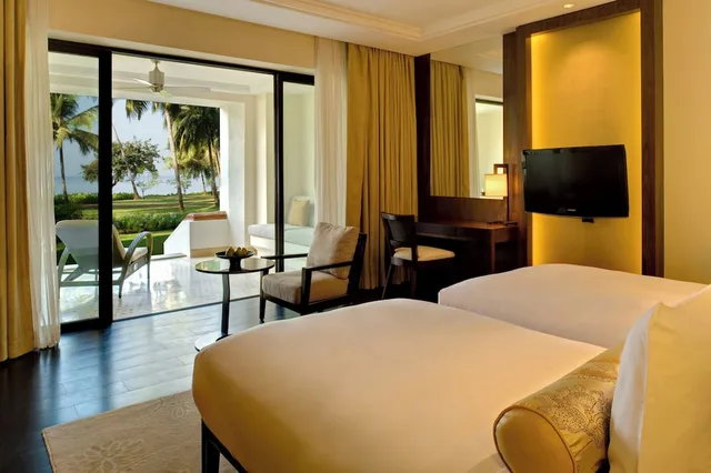 غرفة بسريرين منفصلين بإطلالة على الحديقة بشرفة، GRAND HYATT GOA 9/10