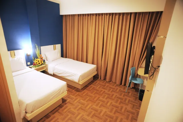 غرفة بسريرين منفصلين، RumaRuma Hotel Kenten Palembang 3/4