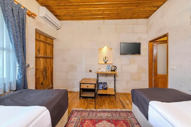 جناح ديلوكس بسريرين منفصلين وسرير كينج، Düven Hotel 4/10