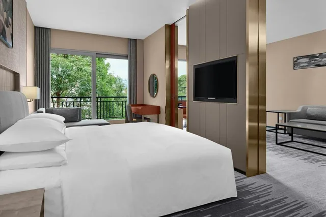 جناح ديلوكس بسرير كوين بإطلالة على المدينة بغرفة نوم واحدة مع دخول صالة النادي، Dongguan Forum Hotel and Apartment 1/3