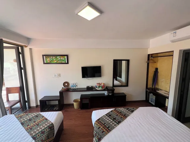 غرفة ديلوكس ثلاثية بسرير كينج وسرير فردي بإطلالة على الجبل بشرفة، Sapa Village Hotel 9/10