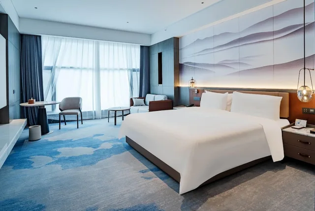 غرفة ديلوكس بسرير كينج مع أريكة، Wyndham Qujing Luliang 1/1
