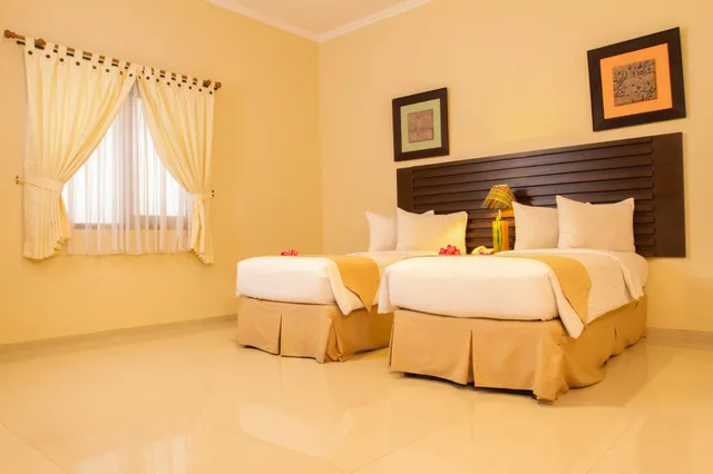 غرفة قياسية بسرير كينج وسرير كوين، Bahamas Hotel And Resort 2/2